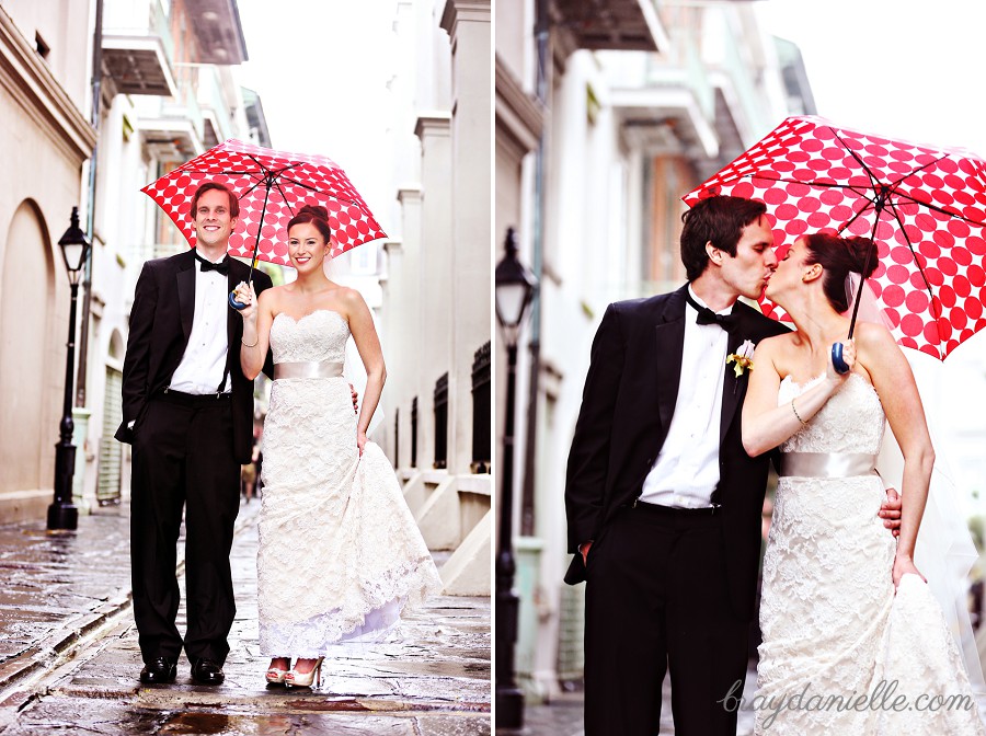 bride and groom with red umbrella