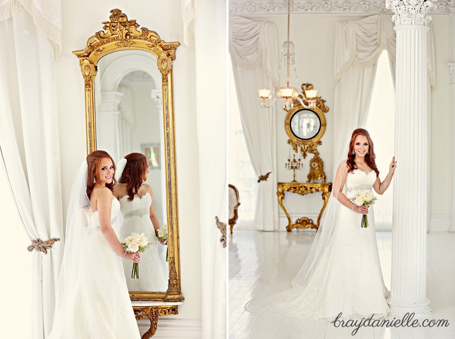 bride with red hair standing in front of a mirror in an all white room by Bray Danielle Photography 