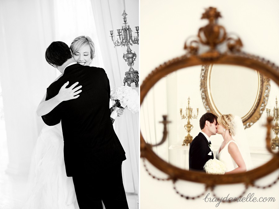 bride and groom kiss in mirror
