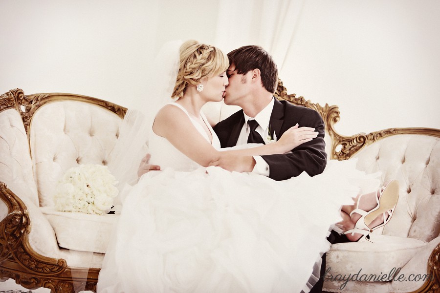 beautiful bride kissing groom