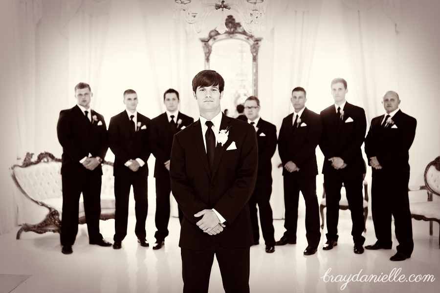 Posed portrait of groom + groomsmen