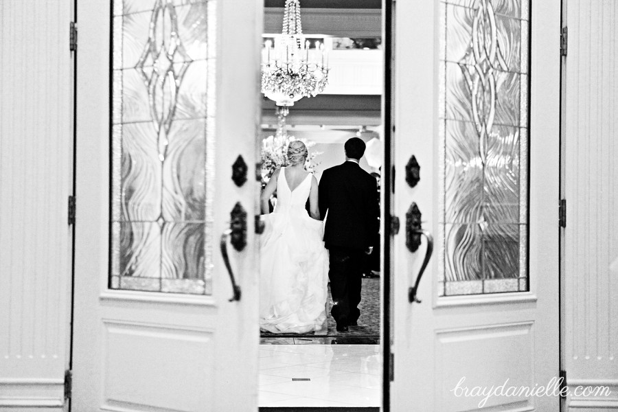 bride and groom through doorway