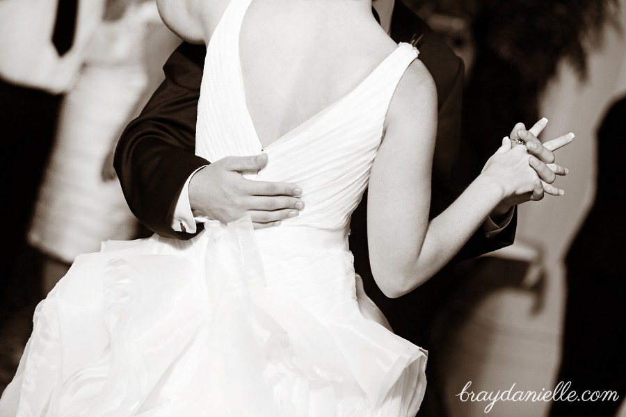 close up details of bride and groom dancing