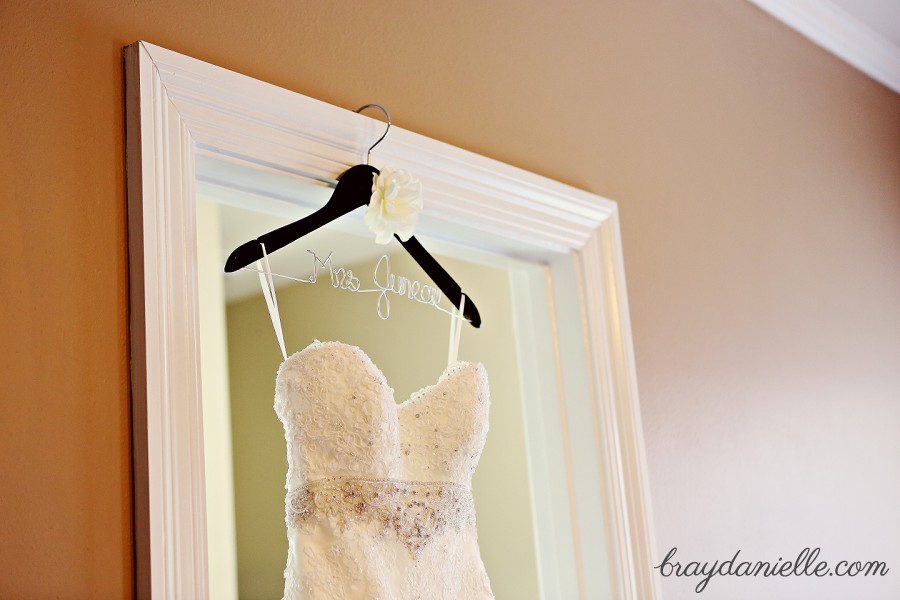 Wedding dress hanging on door frame