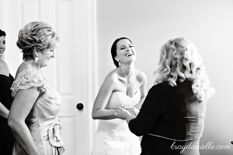 Bride laughing with family