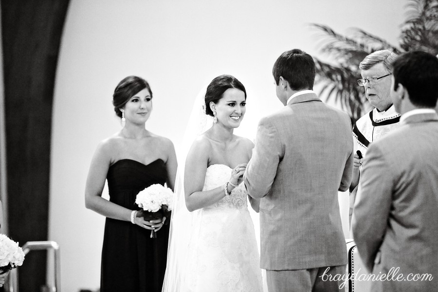 bride and groom exchanging rings