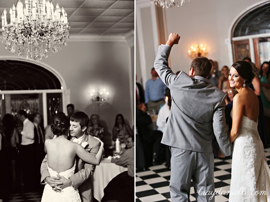 bride and groom dancing under chandelier