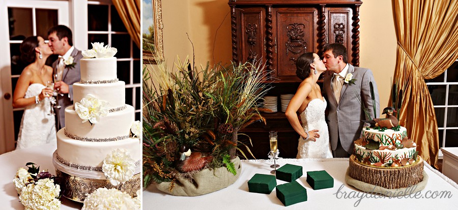 Bride and groom kissing by wedding & grooms cake