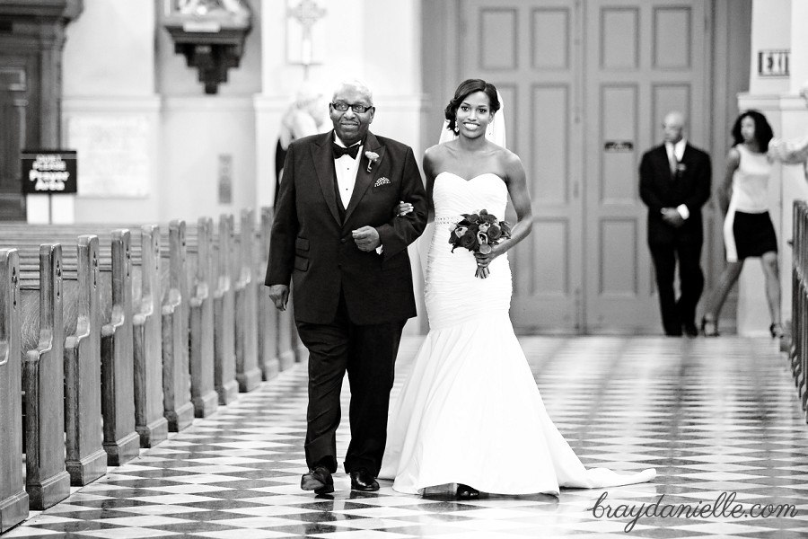 Father of the bride walking bride down the aisle, wedding at St Louis Cathedral in New Orleans