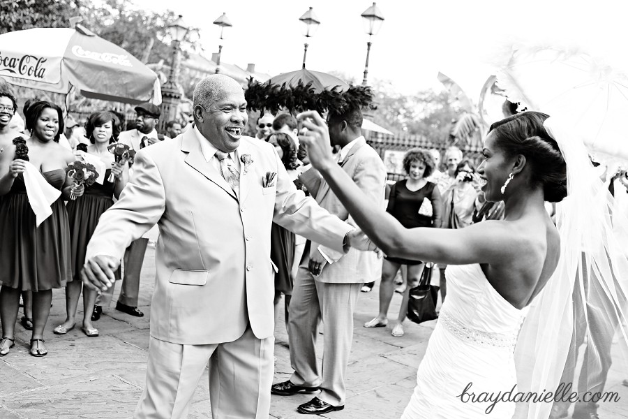 father of the bride and bride dancing outside