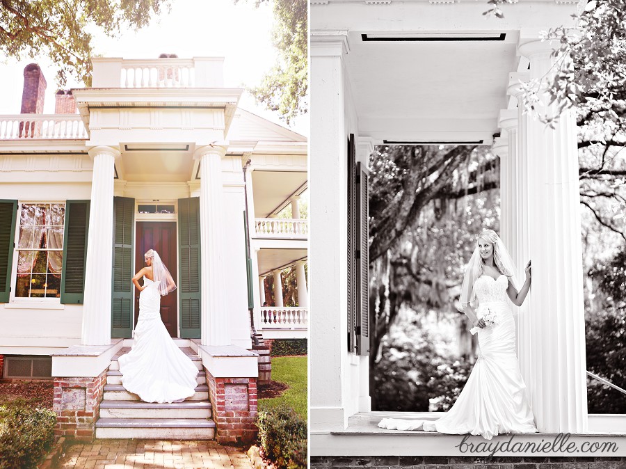 bridal portrait on staircase with her hands on her hips + large columnsby Bray Danielle Photography 