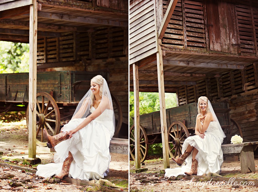 bride putting on cowboy boots sitting on wooden bench laughing by Bray Danielle Photography 