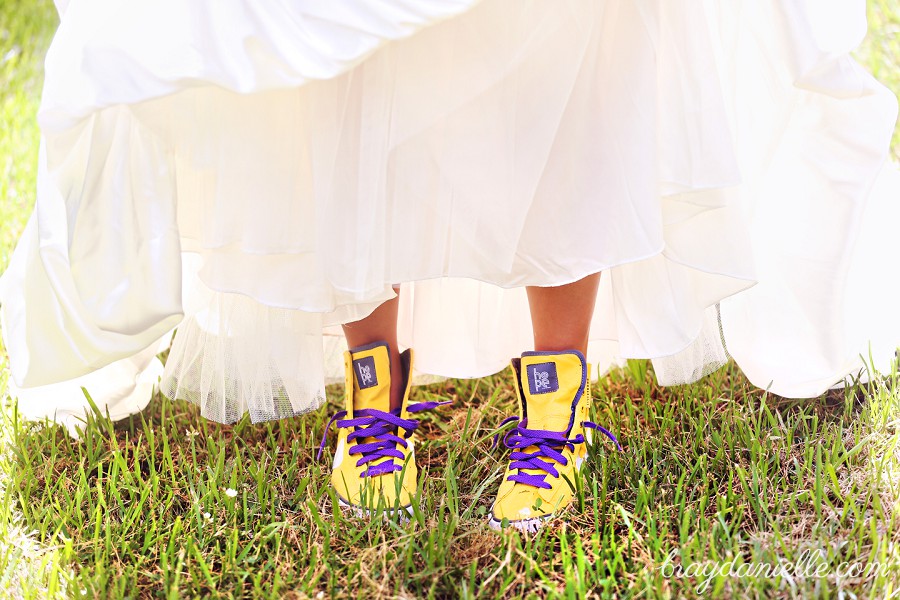 Bride's feet showing her purple and gold hightops under her dress by Bray Danielle Photography 