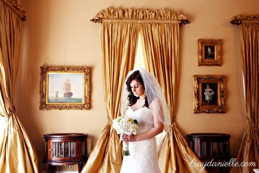 bridal portrait bride looking down at flowers by Bray Danielle Photography 